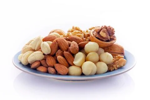 Nutritious, mixed nuts, walnuts, almonds, cashews, macadamia nuts Stock Photos