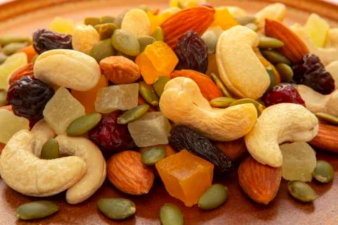 Nutritious, mixed nuts, walnuts, almonds, cashews, macadamia nuts Stock Photos