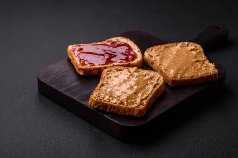Nutritious sandwiches consisting of bread, raspberry jam and peanut butter Stock Photos