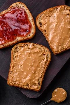 Nutritious sandwiches consisting of bread, raspberry jam and peanut butter Stock Photos