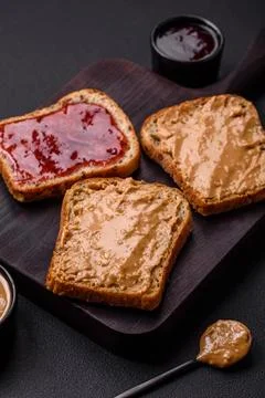Nutritious sandwiches consisting of bread, raspberry jam and peanut butter Stock Photos