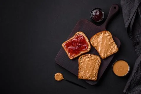 Nutritious sandwiches consisting of bread, raspberry jam and peanut butter Stock Photos