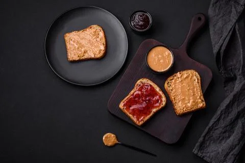 Nutritious sandwiches consisting of bread, raspberry jam and peanut butter Stock Photos
