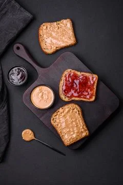 Nutritious sandwiches consisting of bread, raspberry jam and peanut butter Stock Photos
