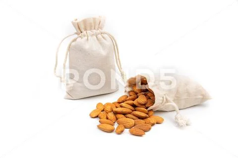 Nuts almonds in a bag on a white background Stock Photos