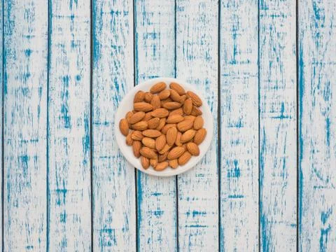 Nuts almonds on a plate Stock Photos