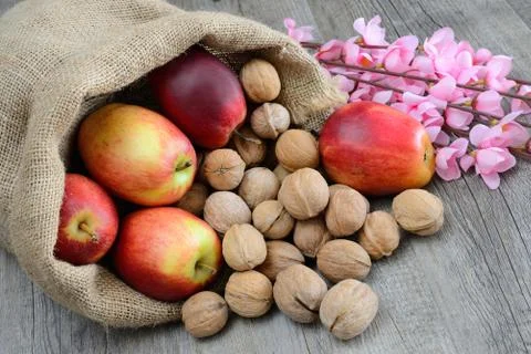 Nuts and apples Stock Photos