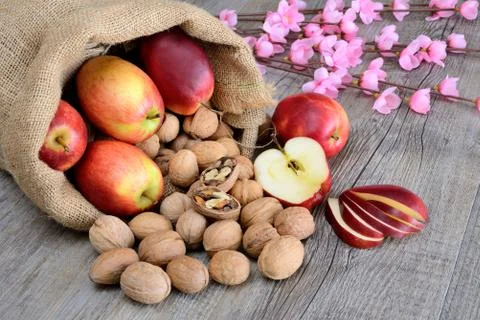 Nuts and apples Stock Photos
