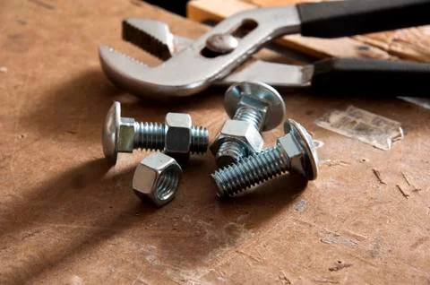 Nuts and bolts on workbench Stock Photos