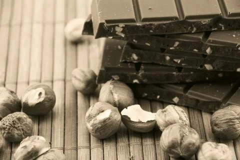 Nuts and chocolate Stock Photos