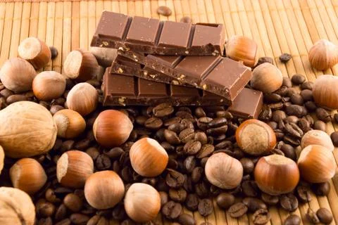 Nuts and chocolate Stock Photos