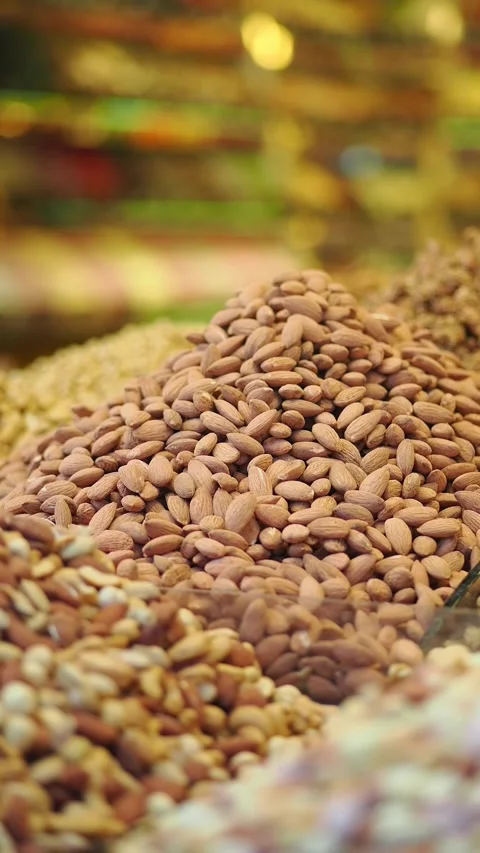 Nuts and dried fruits displayed at a market stall Stock Footage 340493404