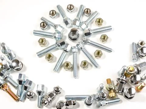 Nuts and studs for a car on a table Foto stock