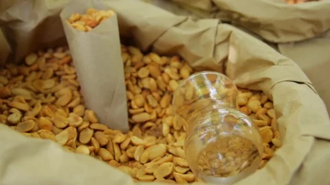Nuts in a bag on the counter. Peanuts close-up. 動画素材 85975814