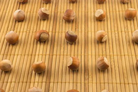 Nuts on a bamboo mat Stock Photos