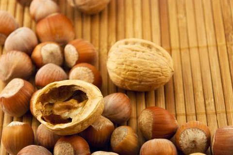 Nuts on a bamboo mat Stock Photos
