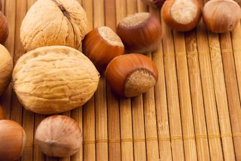 Nuts on a bamboo mat Fotos de archivo