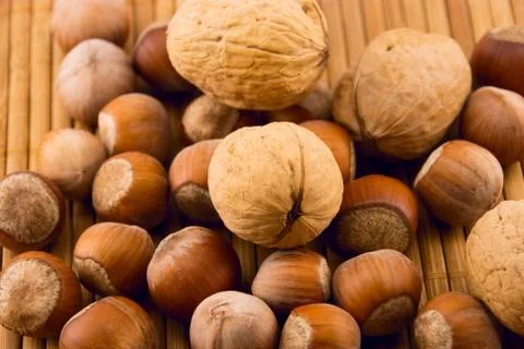 Nuts on a bamboo mat Foto stock