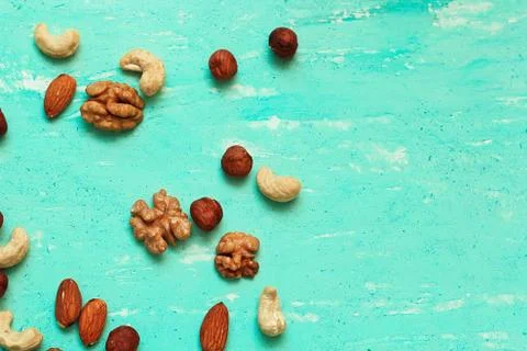 Nuts on a blue background Stock Photos