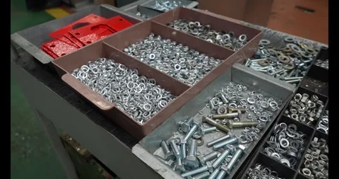 Nuts, bolts and screws in box, bolts and nuts in carton Stock Footage 333980056