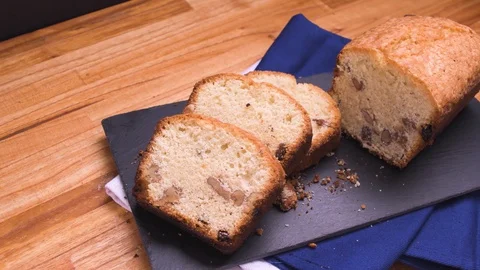 Nuts Bread Cake Three Portions Pan Close Up On Black Slate Over Wood Video stock 128092067