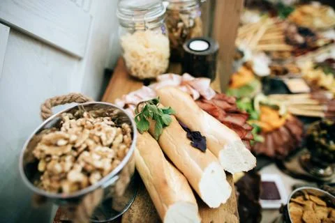 Nuts in bucket on a wedding buffet table snacks. Stock Photos