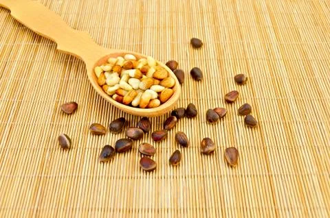 Nuts of cedar on a bamboo mat Stock Photos
