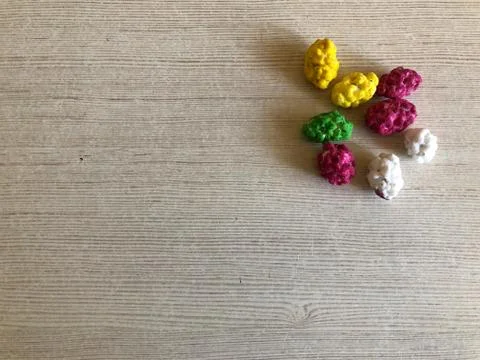 Nuts in colored glaze on a light background Stock Photos