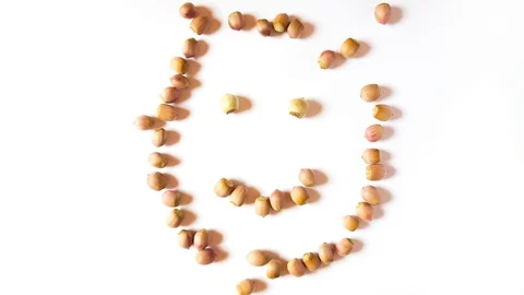 Nuts create a happy face with smile and scatter3321-3445 Stock Footage 116748335