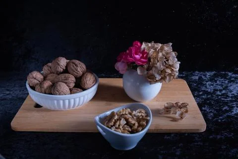 Nuts in a cup on the table. Stock Photos