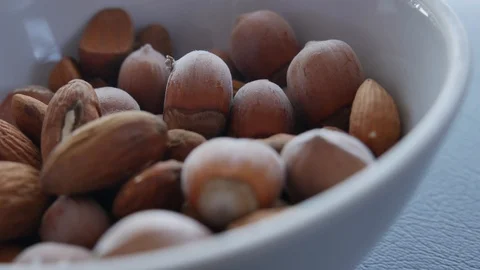Nuts Detail. Hazelnuts Close up. Almonds and Hazelnuts are in the Plate. Stock Footage 118703097