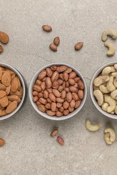 Nuts of different varieties, top view. Vertical photo for background, nuts in Stock Photos