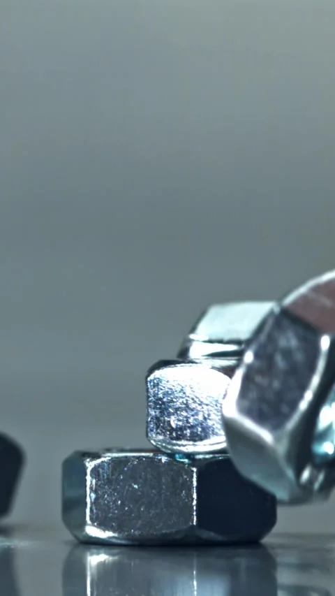 Nuts fall on a metal surface. Filmed on a high-speed camera at 1000 fps Stock Footage 335379344