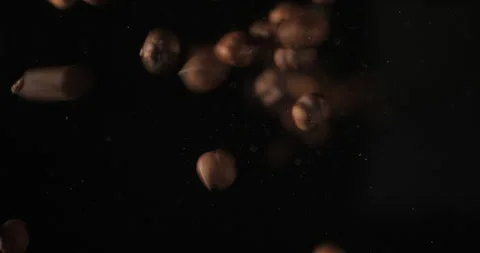 Nuts falling from below, slowmotion low angle 4K pro res Stock Footage 275897662