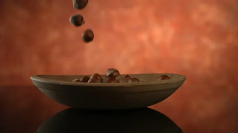 Nuts falling on plate Video stock 61671835