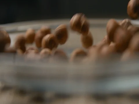 Nuts falling slowmotion‚ orginal file: 4K DCI, PRO RES 444, 12 bits Stock Footage 82038551