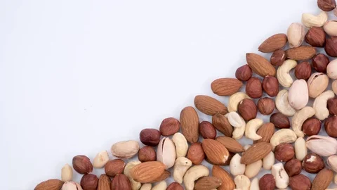 Nuts filling the lower right of the frame. Stop motion Video stock 72717009