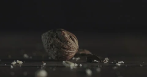 Nuts filmed in slow motion with a dark mood on a wooden background. Stock Footage 172158474