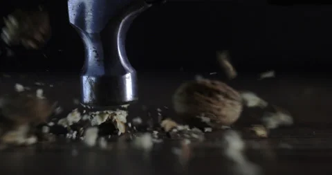 Nuts filmed in slow motion with a dark mood on a wooden background. Stock Footage 172158549