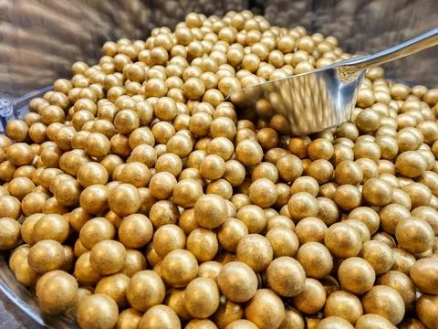 Nuts in glaze. Nuts in chocolate. Hazelnuts in golden glaze. Hazelnuts in g.. Photos