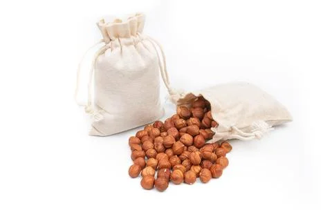 Nuts hazelnut in a bag on a white background Stock Photos