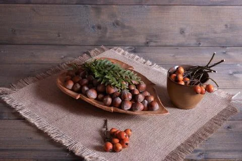 Nuts on the material and on the table. Stock Photos