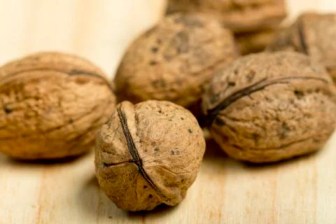 Nuts on a pine wood background. Stock Photos