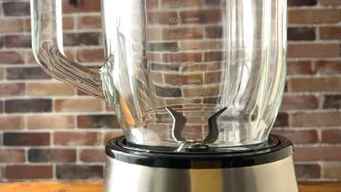 Nuts is pouring in blender, slow motion video Stock Footage 98549265