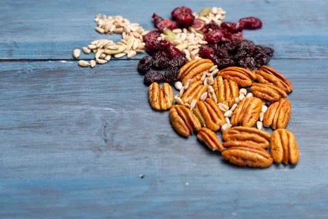 Nuts in the shape of a human heart with walnut, raisins, pumpkin seeds, dried Stock Photos