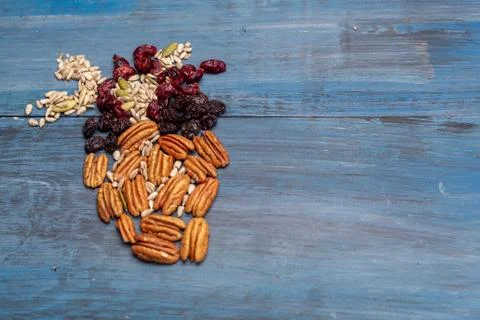 Nuts in the shape of a human heart with walnut, raisins, pumpkin seeds, dried Stock Photos
