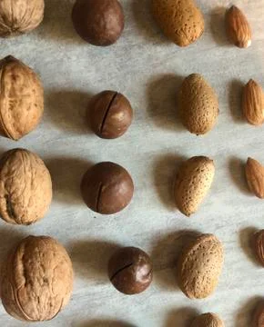 Nuts stacked in order on the table surface Stock Photos