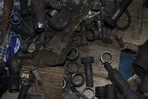 Nuts, washers, bolts, working process. Tool in fuel oil. Stock Photos