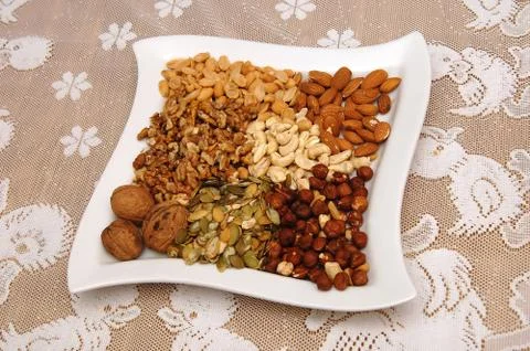 Nuts on a white plate Foto stock