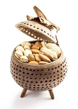 Nuts in wooden package Stock Photos